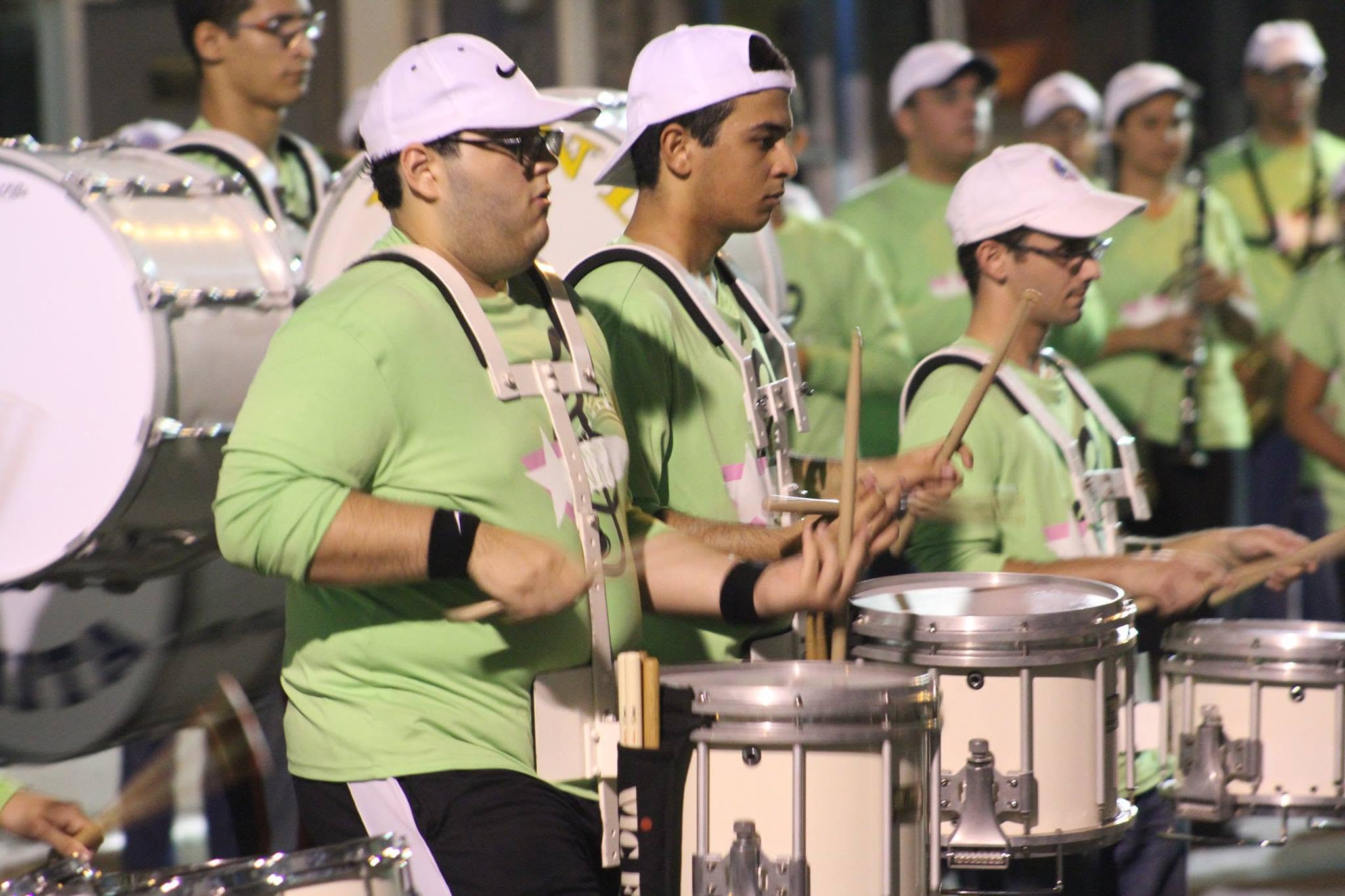 Peter Rodriguez performing with a marching percussion section